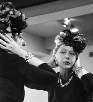 Lily Dache checking out her hat design