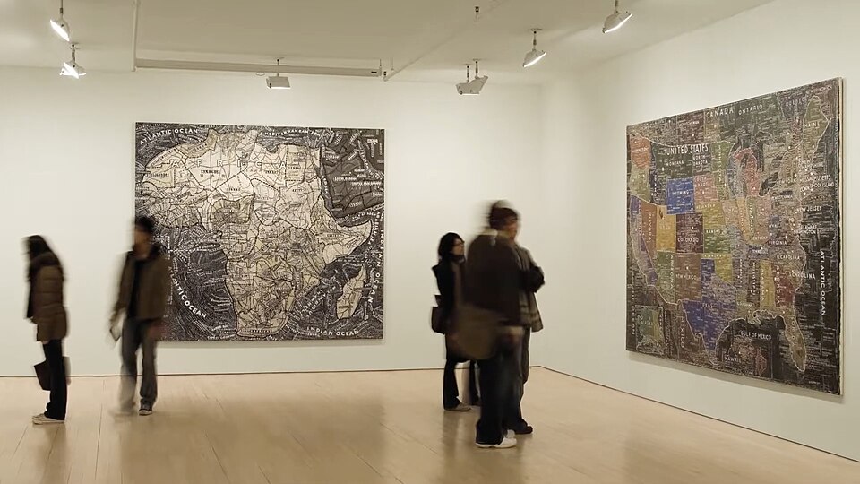 Paintings of maps by Paula Scher on exhibit